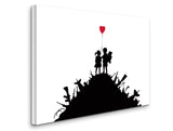 a silhouette of a couple holding a red balloon on top of a hill