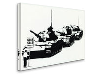 a black and white picture of tanks on a wall