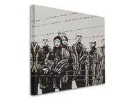 a picture of a group of people behind a barbed wire fence