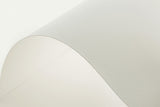 a close up of a white wall with a curved corner