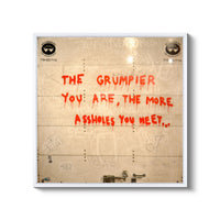 a wall with graffiti written on it that says the grumpier you are the
