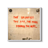 a wall with graffiti written on it that says the grumpier you are the