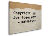 a sign on a wall that says copyright is for losers