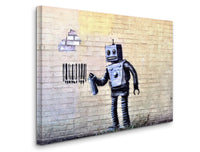 a robot painted on a brick wall holding a bucket