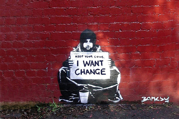 a graffiti of a man holding a sign that says i want change