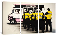 a group of police officers standing in front of a bus