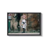 a picture of a child with a heart on a wall