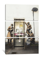 a couple of men standing next to a door