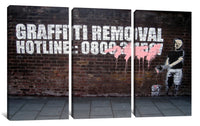 a brick wall with graffiti on it and a man holding a skateboard