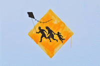 a kite flying in the sky with a picture of people on it