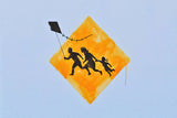 a kite flying in the sky with a picture of people on it