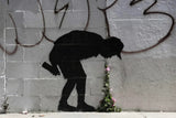 a graffiti of a man with a flower in his hand