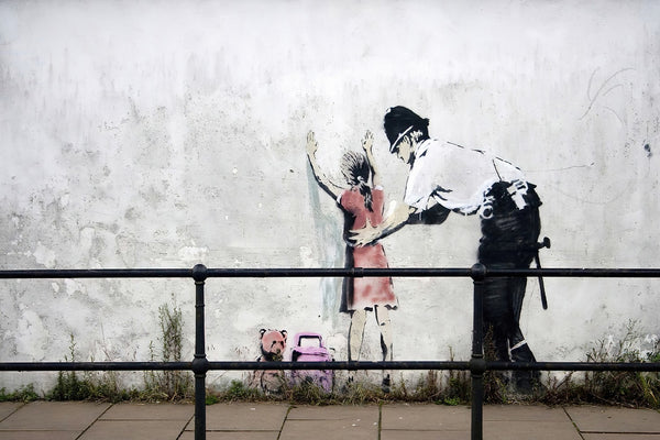 a painting of a man and a little girl on a wall