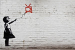 a painting of a girl flying a kite on a brick wall