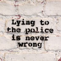 a brick wall with a graffiti on it that says lying to the police is never