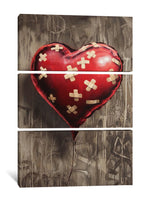 a painting of a red heart with crosses on it