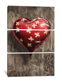 a painting of a red heart with crosses on it