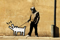 a man walking a dog on a leash next to a wall