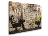 a brick wall with a painting of a man sitting on a bench and a banana
