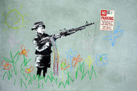 a painting of a boy with a gun on a wall